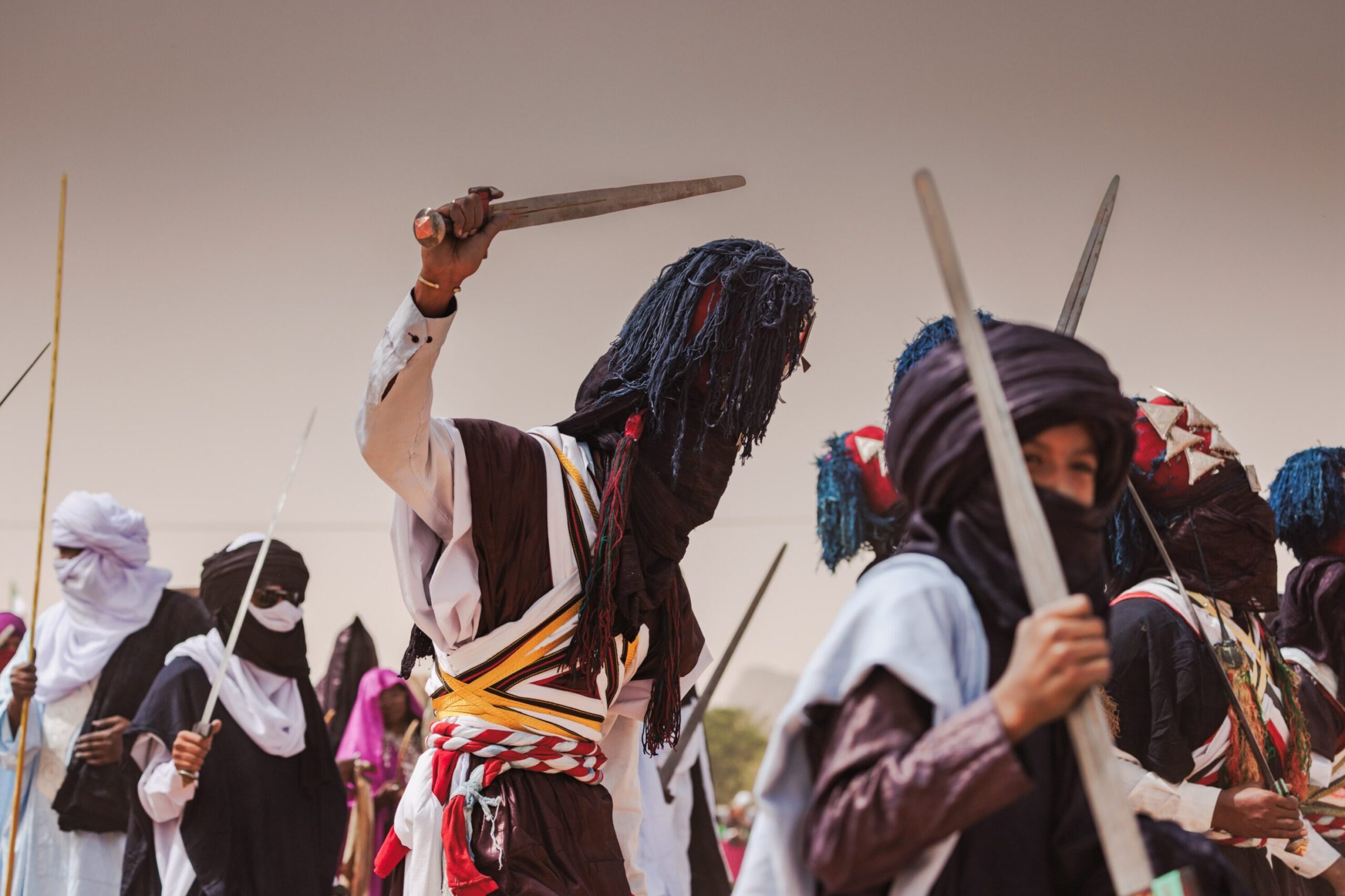 Dancers in traditional dress performing at the Sebeïba festival in Djanet, Algeria